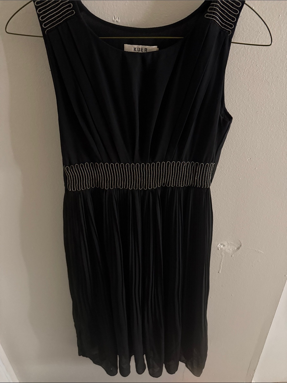Black Sleeveless Pleated Dress with Metallic Waist Detail